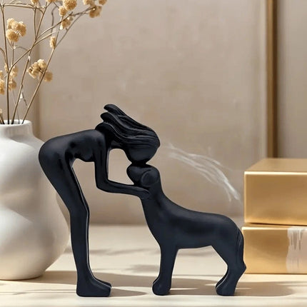 Black minimalist sculpture of a human and a dog. Freeze the moment of embrace, a declaration of eternal companionship dedicated to you.