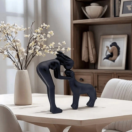 Black minimalist sculpture of a human and a dog. Freeze the moment of embrace, a declaration of eternal companionship dedicated to you.